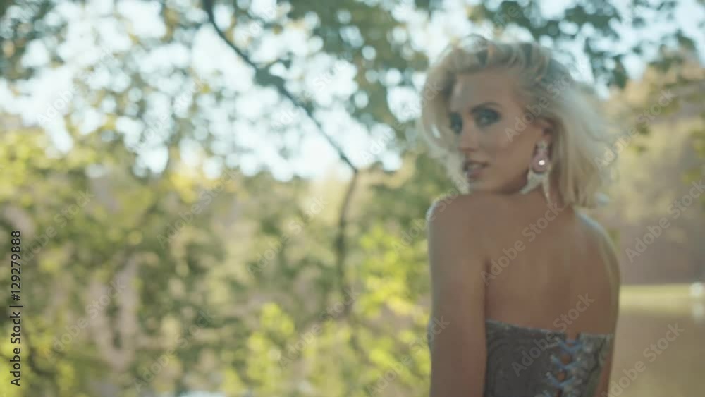 Clip presenting sensual woman in the summer park Clip presenting sensual woman in the summer park