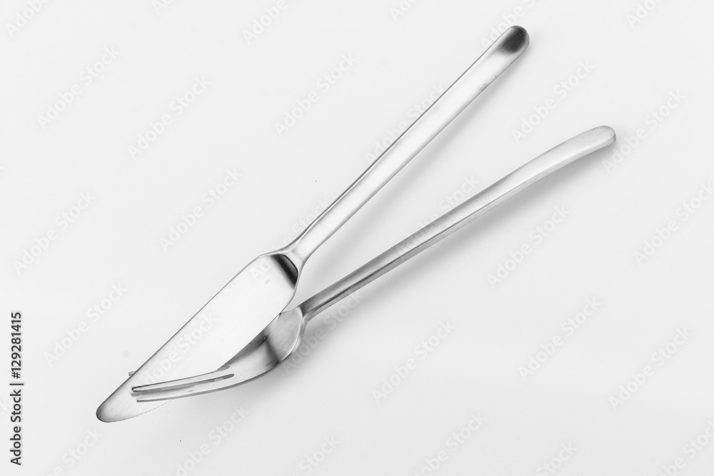 Knife and fork crossed, isolated on white background Knife and fork crossed, isolated on white background