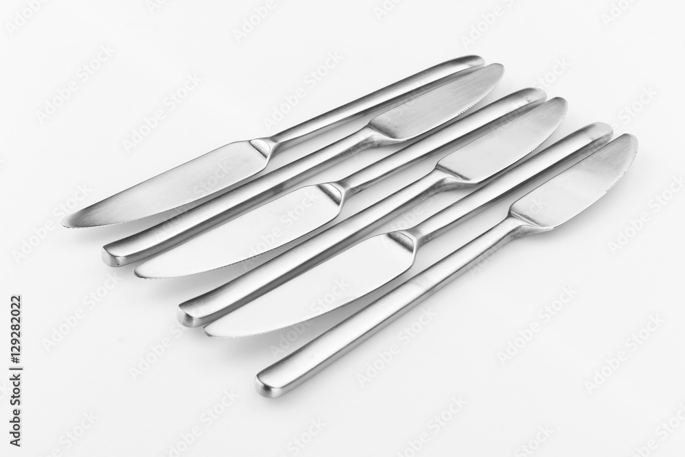 Stainless steel kitchen glossy metal knife isolated over the white background, set of multiple different foreshortenings Stainless steel kitchen glossy metal knife isolated over the white background, set of multiple different foreshortenings
