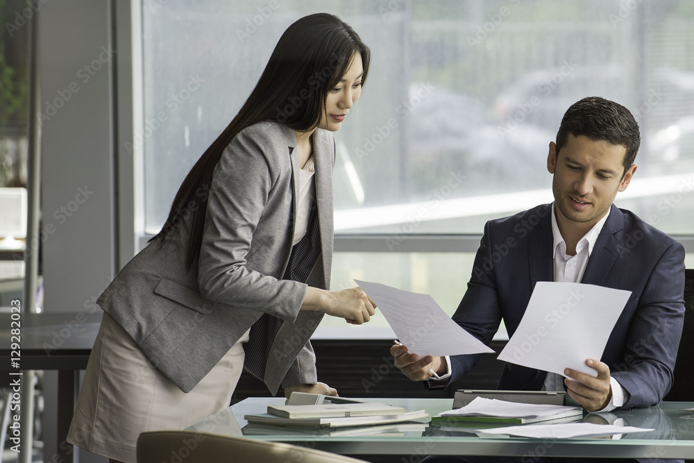 Business associates reviewing documents Business associates reviewing documents