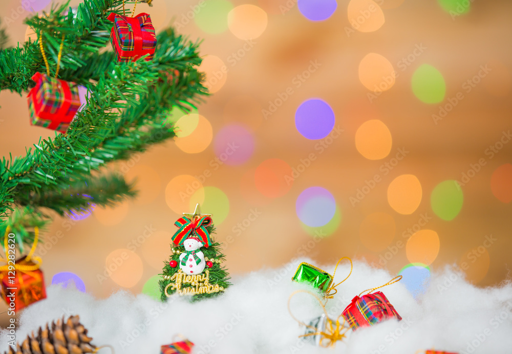 Snowman and gift boxes on bokeh background Snowman and gift boxes on bokeh background