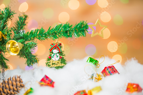 Snowman and gift boxes on bokeh background