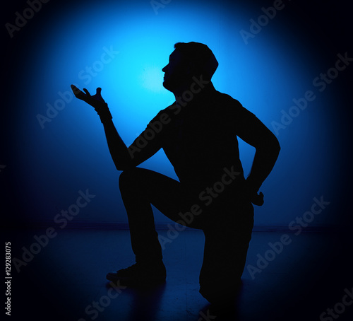 silhouette Rocker man posing on blue background © sandyche