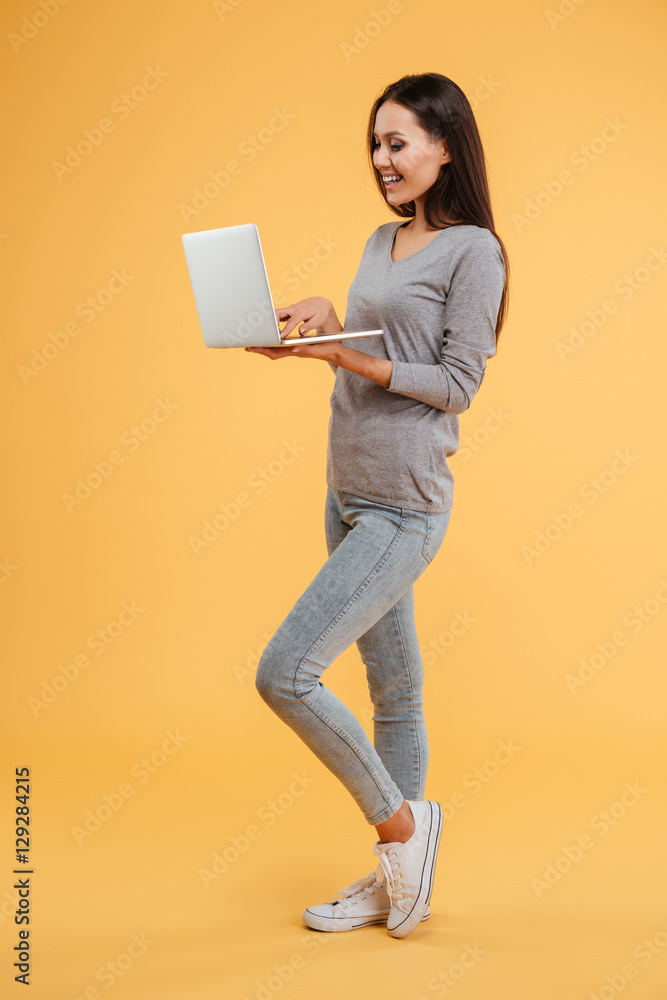 Full length young model with laptop Full length young model with laptop