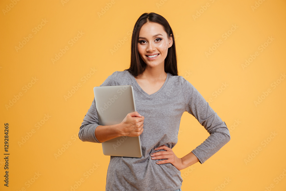 Model holding laptop in hand Model holding laptop in hand