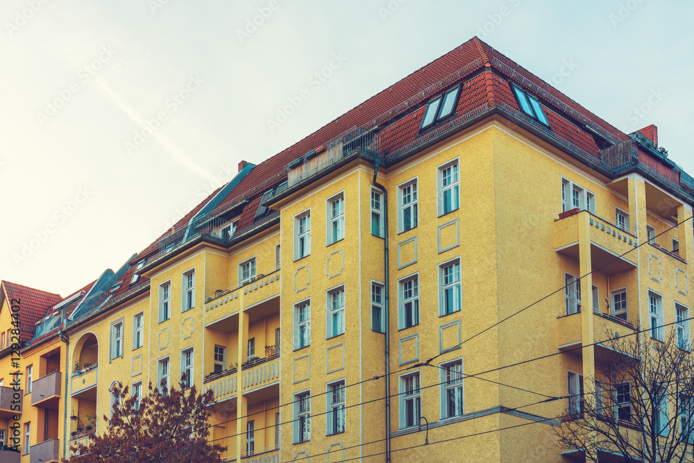 Naklejka premium historical and luxury apartment building with yellow facade