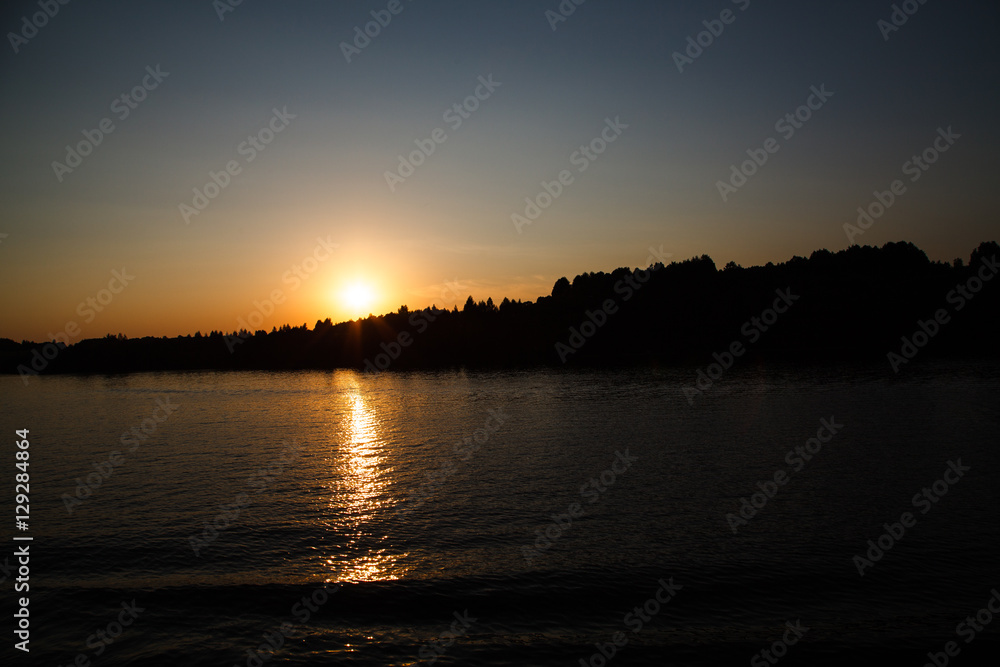 Beautiful sunset over the Volga river (Russia). Summer.
