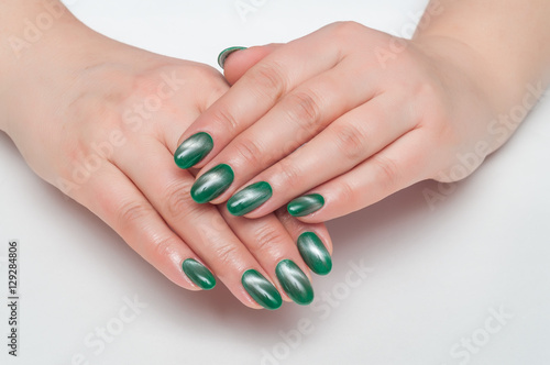Manicure on long nails oval green cat's eye