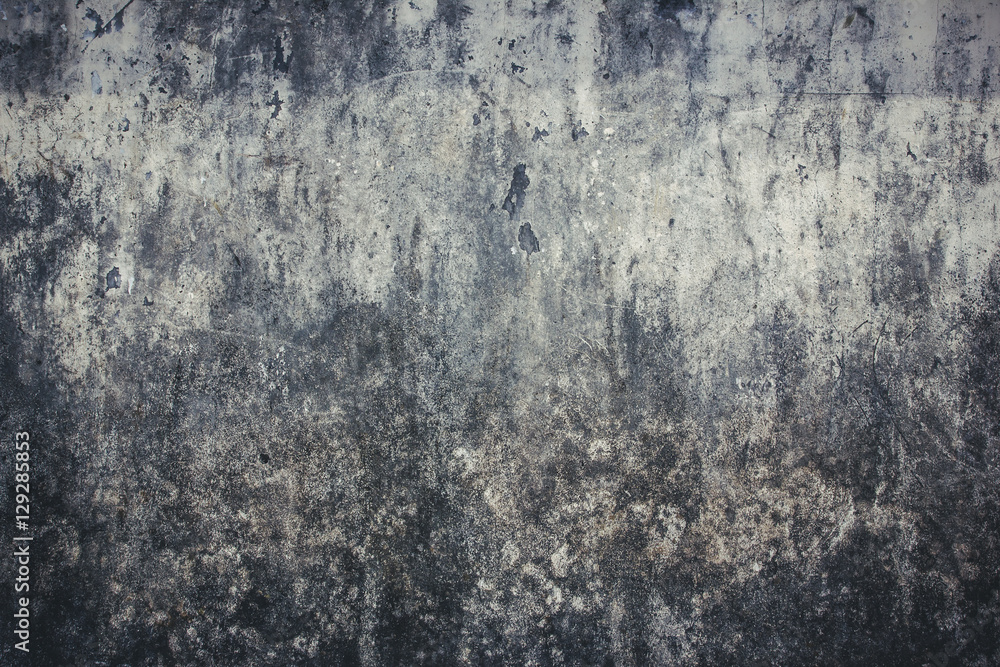 Grunge dirty stained concrete wall with peeling paint background.