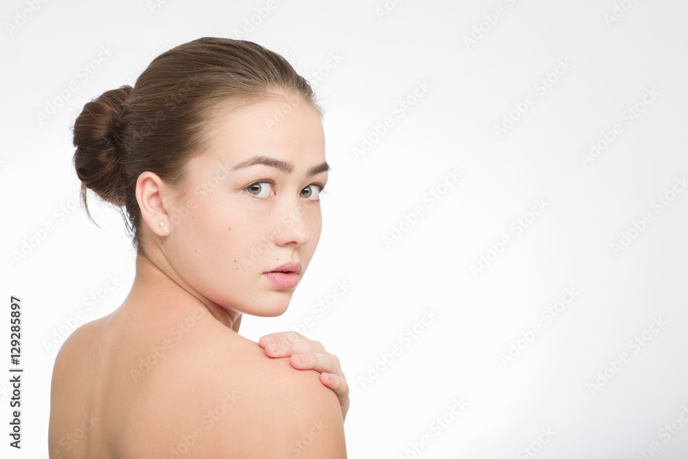 shocked scared girl looking back over shoulder on white background shocked scared girl looking back over shoulder on white background