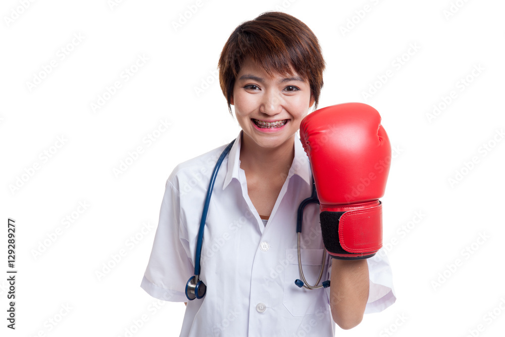 Young Asian female doctor with boxing glove. Young Asian female doctor with boxing glove.