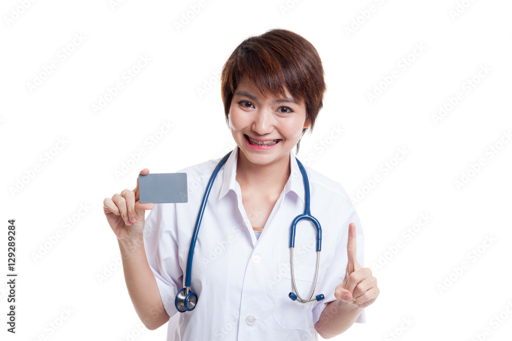 Asian young female doctor show one finger with blank card. Asian young female doctor show one finger with blank card.