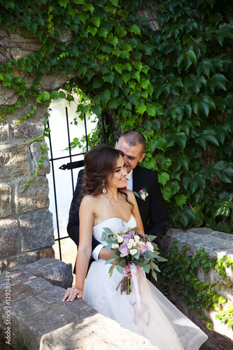 Wallpaper Mural Bride and groom walking around buildings. Wedding day. Holiday c Torontodigital.ca