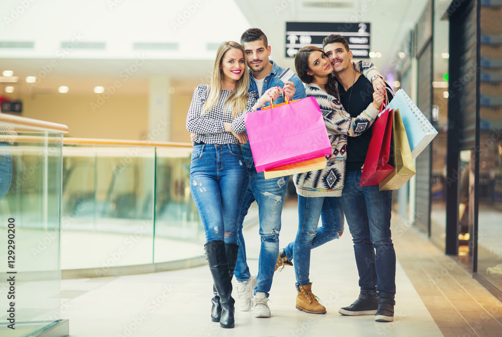 Group Of Young Friends Shopping In Mall Together Group Of Young Friends Shopping In Mall Together