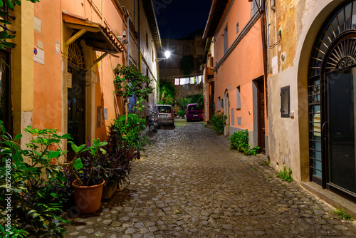 Fototapeta Naklejka Na Ścianę i Meble -  Night view of old street in Trastevere in Rome, Italy
