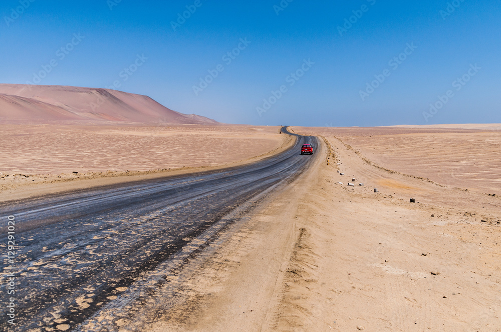 Road passing through Paracas desert, Peru