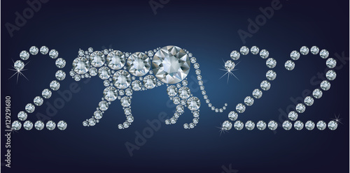 Happy new year 2022 creative greeting card with Tiger made up a lot of diamonds