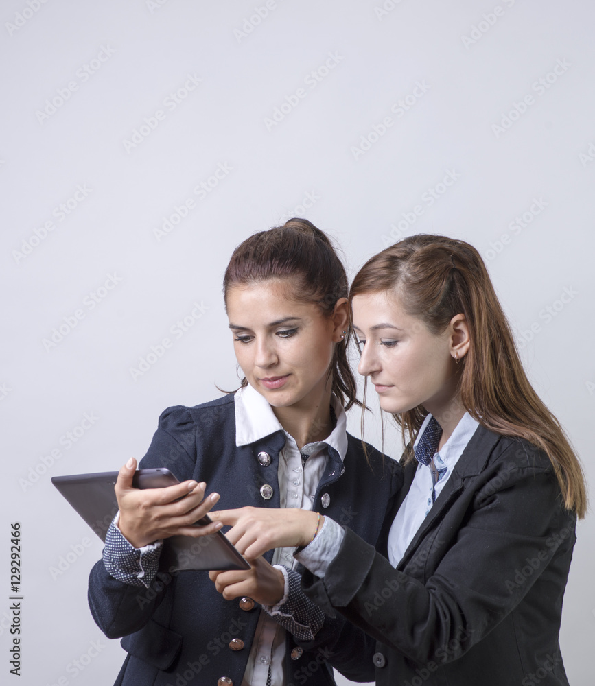 Two business partners, looking at tablet Two business partners, looking at tablet