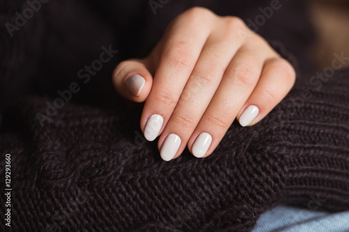 Beautiful woman nails with a beautiful bright manicure