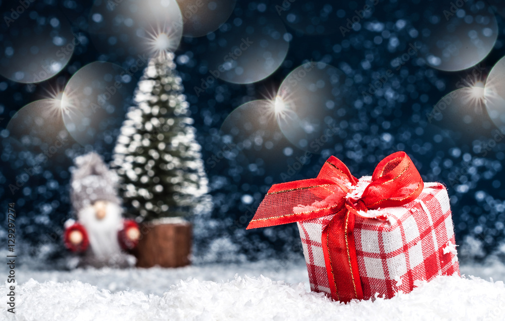 Christmas presents with red bows in the snow Christmas presents with red bows in the snow