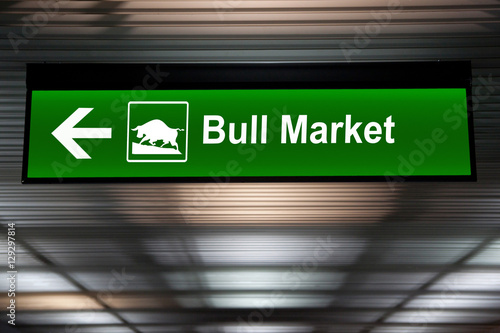A modified sign indicating a bull market ahead. Green color