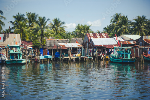 Fishing village with houses and boats in Vietnam.