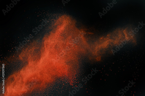 Launched colorful powder  isolated on black background