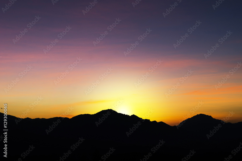 Beautiful silhouette landscape and sunset at night on a meadow on early winter