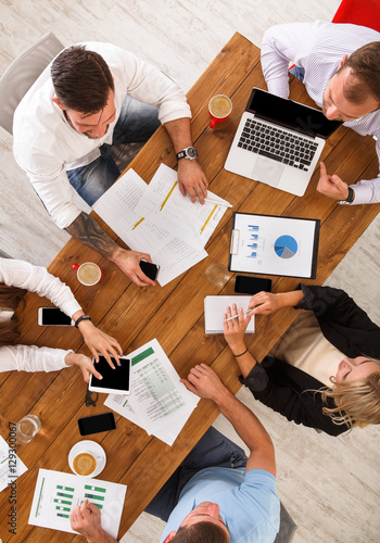 Group of busy business people working in office, top view