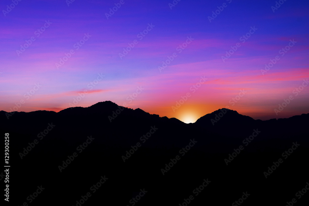 Beautiful silhouette landscape and sunset at night on a meadow on early winter