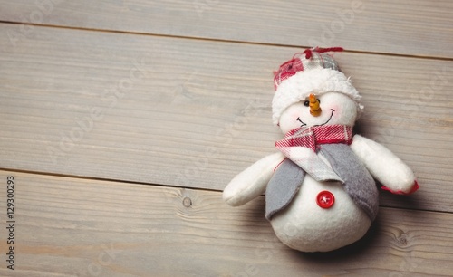 Close-up of snowman on wooden table