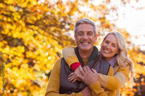 Portrait of smiling couple standing at park