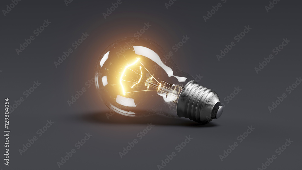 Low glowing electric bulb lamp on dark background Low glowing electric bulb lamp on dark background