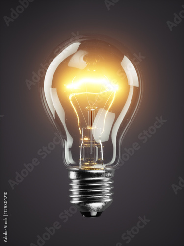 Fotografija Low glowing electric bulb lamp on dark background