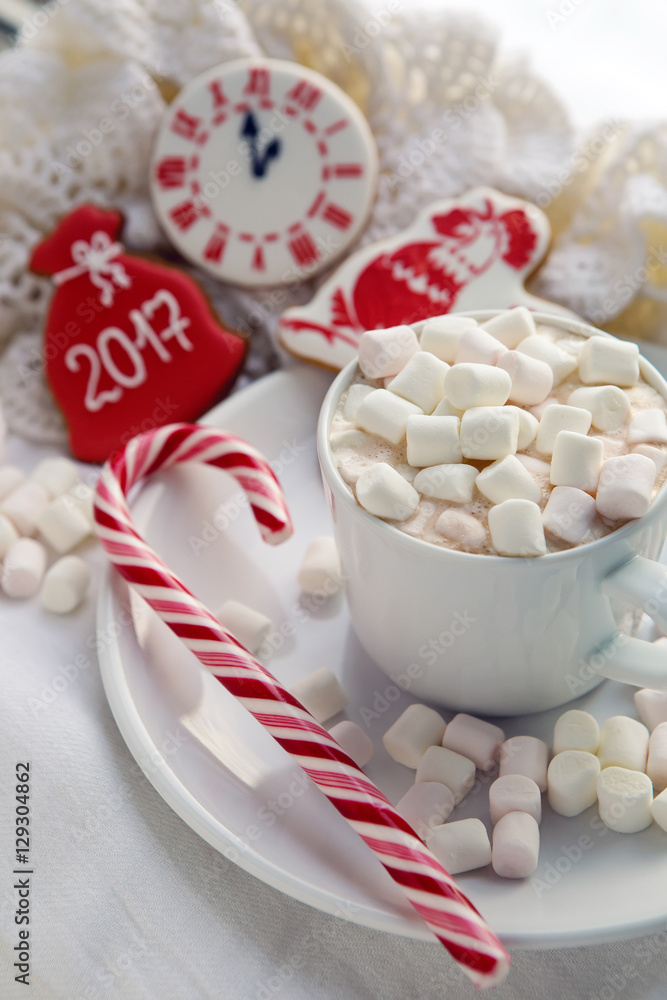 white Cup of cocoa on a saucer, marshmallows and candy white Cup of cocoa on a saucer, marshmallows and candy