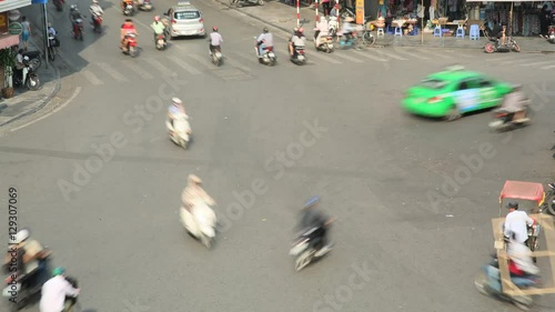 Timelapse view of crazy traffic in Hanoi Hoan Kiem district old quarter . photo
