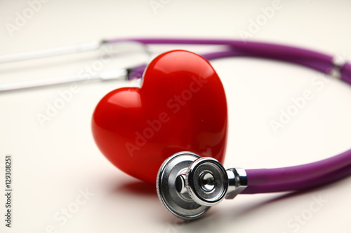 Heart with a stethoscope, isolated on white background