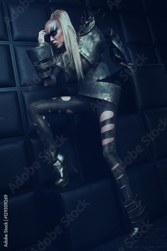 Blond woman in steel armor posing  © EVGENY FREEONE