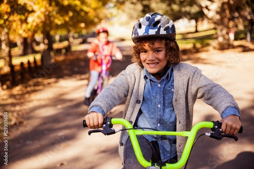 Portrait of smiling boy riding bicycle 