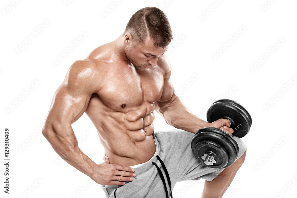 Muscular bodybuilder guy doing exercises with dumbbell Muscular bodybuilder guy doing exercises with dumbbell