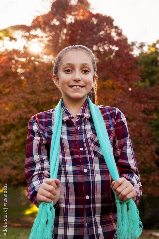 Low angle portrait of happy girl in park during autumn Low angle portrait of happy girl in park during autumn