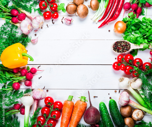 Beautiful background healthy organic eating. Studio photography the frame of different vegetables and spices on the white boards with free space for you text.