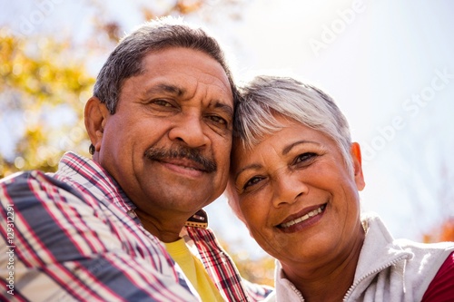 Portrait of elderly couple embracing