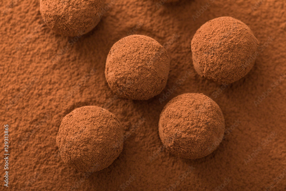 Close up of group of appetizing black chocolate truffles covered Close up of group of appetizing black chocolate truffles covered