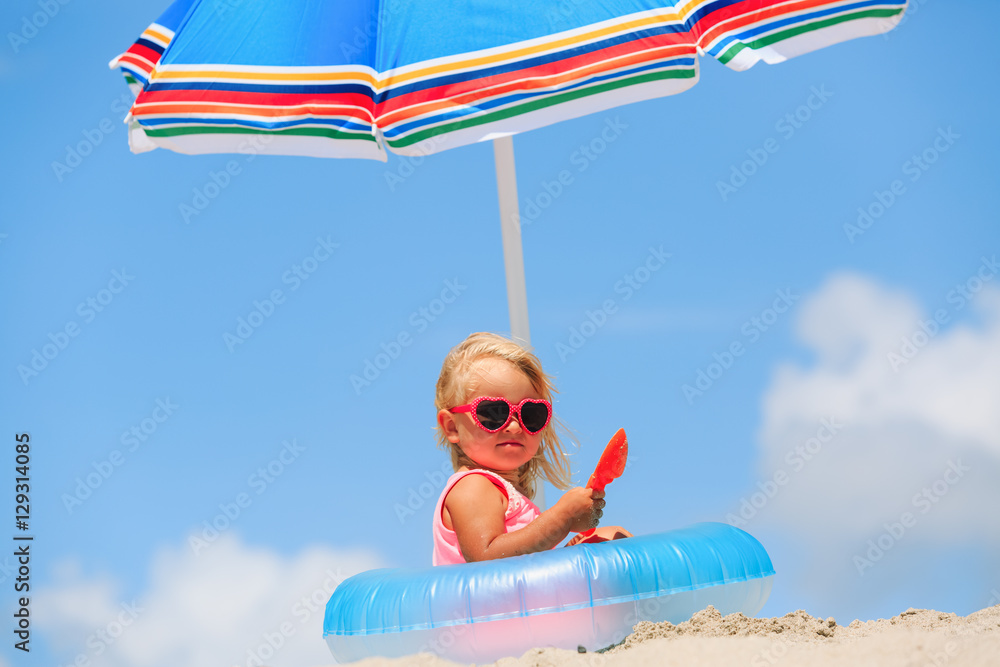 cute little girl play at summer tropical beach