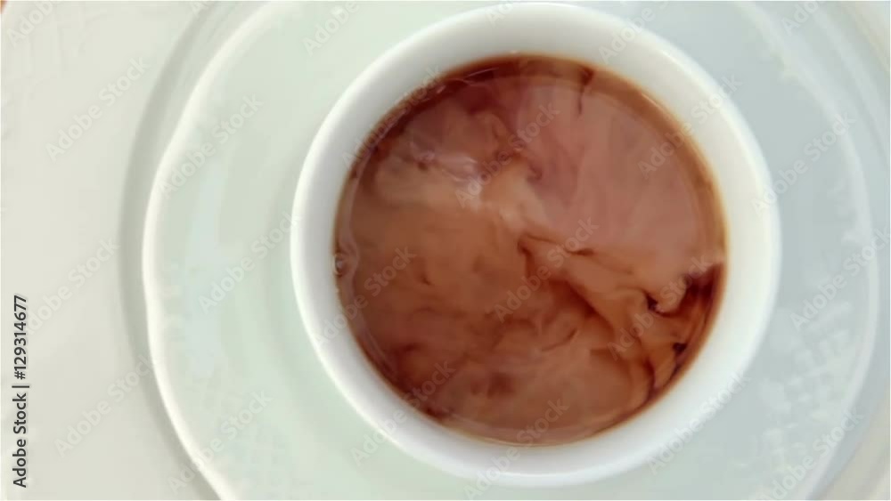 milk poured in to tea milk poured in to tea