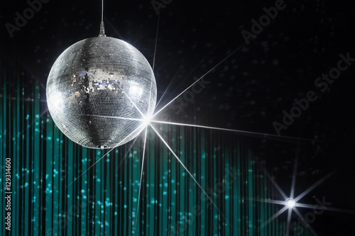 Party disco ball with stars in nightclub with striped turquoise and black walls lit by spotlight, nightlife entertainment industry
