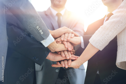 Business team joining hands together