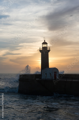 Lighthouse in mouth of Douro river, Porto, Portugal.