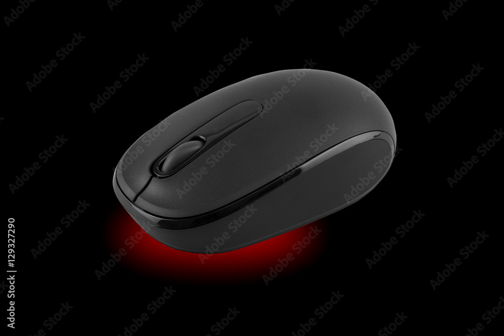 Wireless computer mouse isolated on black background Wireless computer mouse isolated on black background